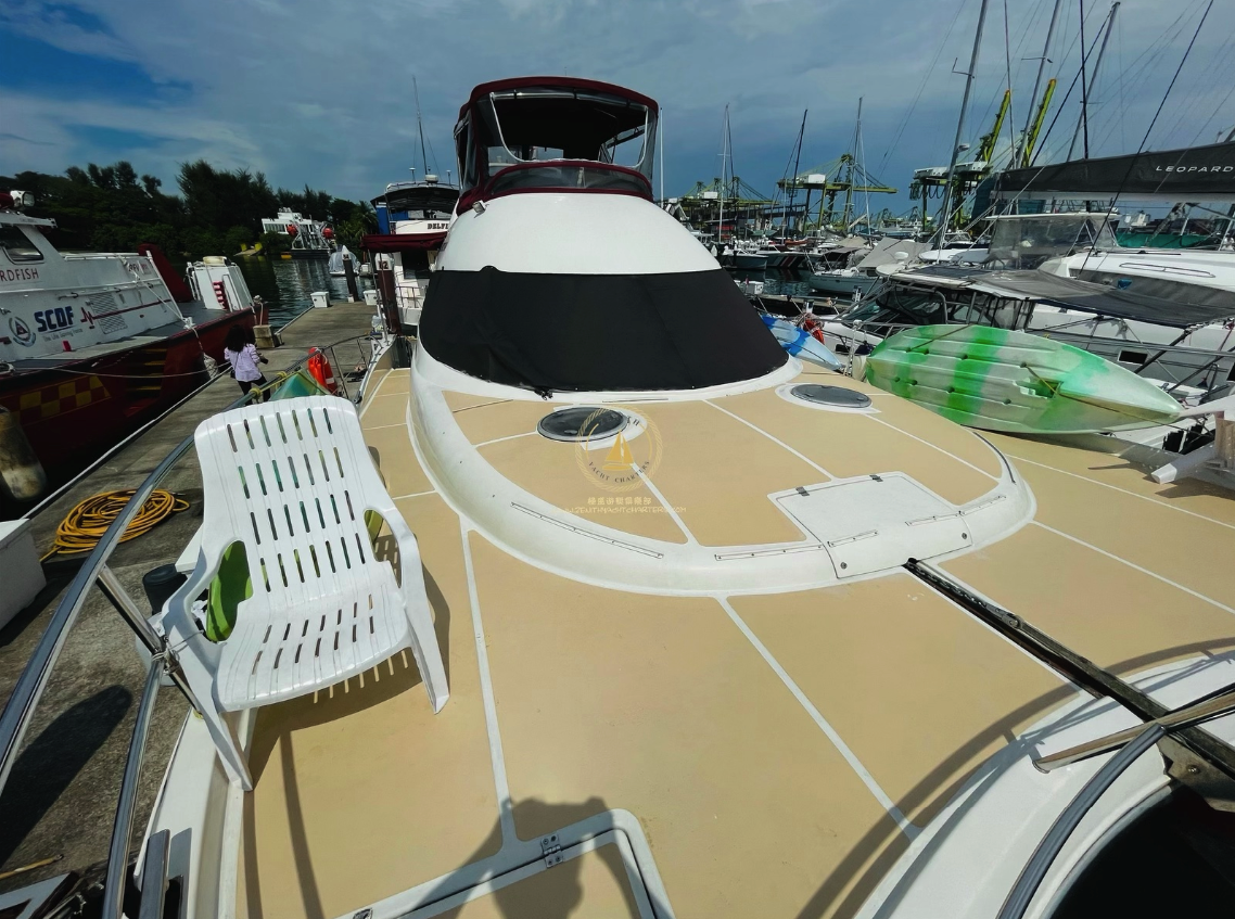 Friends toasting with pink champagne on a yacht.