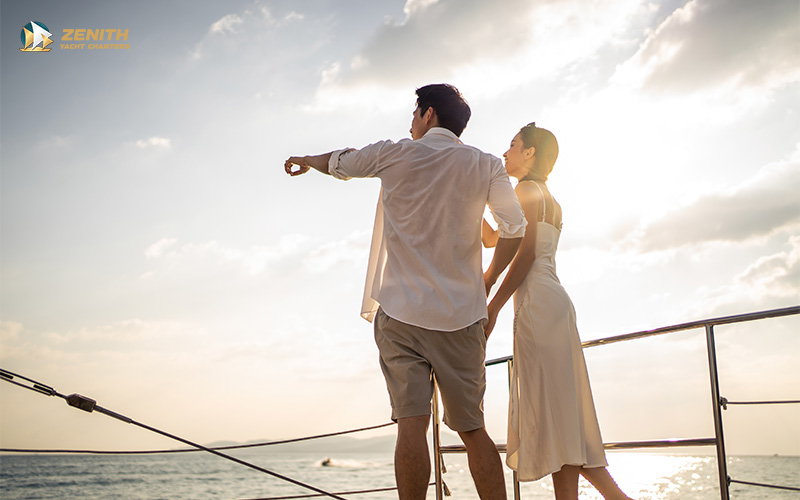 A couple on a romantic sunset yacht cruise.